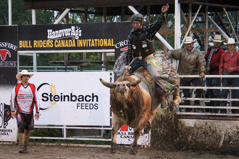 Bull riders struggled to stay aboard their full eight seconds in the arena, which had been turned to mud by a day of rain.