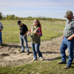 SRRWD manager Jodi Goerzen (centre) explains a water retention project alongside landowner Wayne Chubaty (second from right).