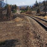 An eastward-facing view from the north edge of the crossing at Mile 98.14 of CN’s Ashcroft subdivision, where BCWS suspected the Lytton fire began. (TSB photo)
