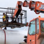 A City of Iqaluit worker fills a water truck at the Sylvia Grinnell River after authorities ordered the Nunavut capital’s 7,000 residents not to drink the city’s water due to suspected fuel contamination, on Oct. 14, 2021. (Photo: Reuters/Casey Lessard)