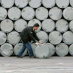 A worker moves a crude palm oil tank in Thailand’s Petchaburi province on Jan. 14, 2008. Buoyed in part by the current energy crisis, Malaysian palm oil futures have risen recently to record levels, providing some support for other vegoils.