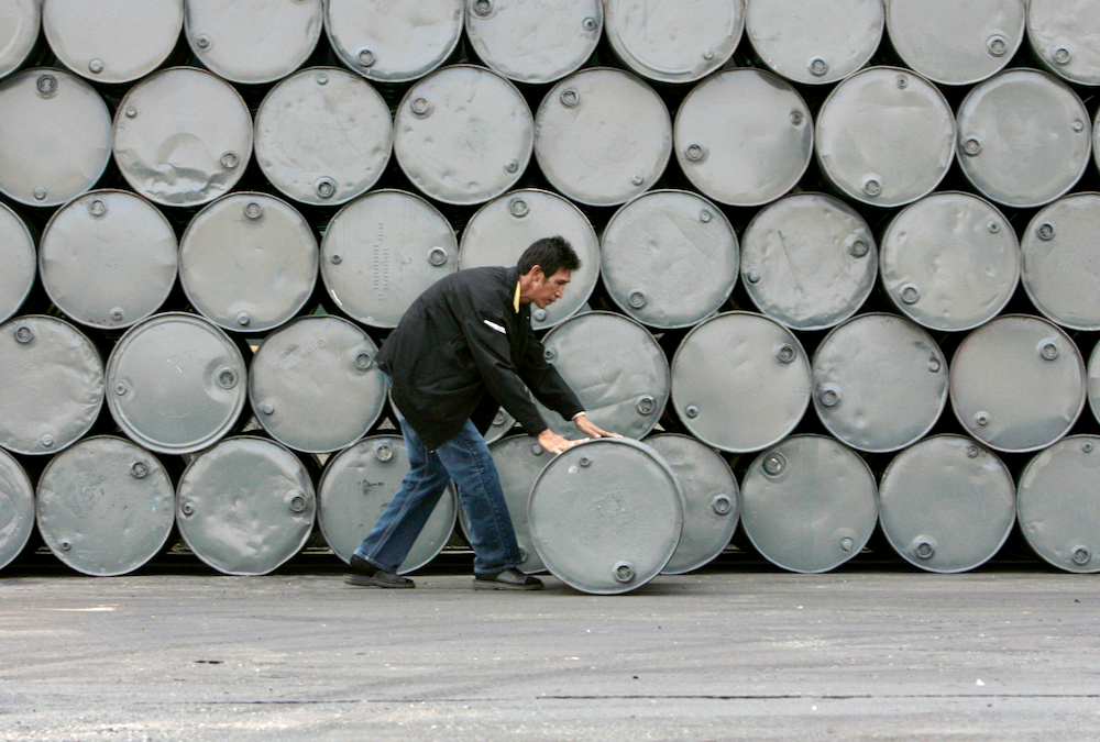 A worker moves a crude palm oil tank in Thailand’s Petchaburi province on Jan. 14, 2008. Buoyed in part by the current energy crisis, Malaysian palm oil futures have risen recently to record levels, providing some support for other vegoils.