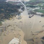 Floodwaters cover the Trans Canada Highway near Abbotsford, B.C. in an aerial view taken Nov. 16, 2021. (Photo courtesy BC Hydro via Reuters)
