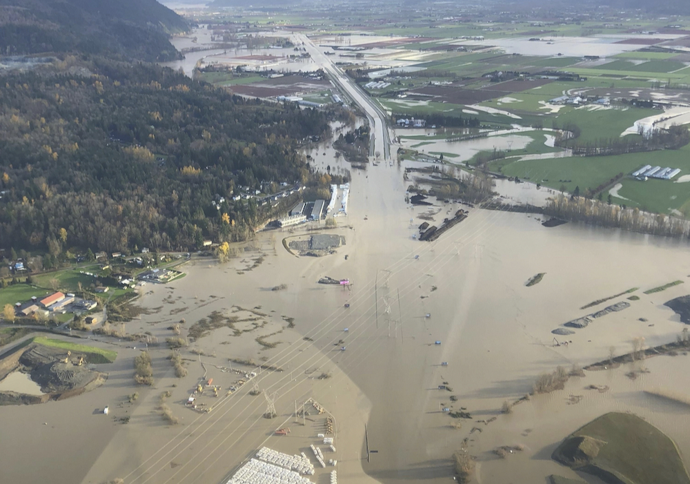 Flood waters cover the Trans-Canada Highway near Abbotsford, B.C. in an aerial view Nov. 16. Washouts on roads and rail lines effectively severed bulk and container traffic in and out of the Port of Vancouver. 
