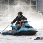 BELOW: Cows that were stranded in a flooded barn at Abbotsford, B.C. are rescued on Nov. 16 by people in boats and on a Jet Ski. photo: Reuters/Jennifer Gauthier