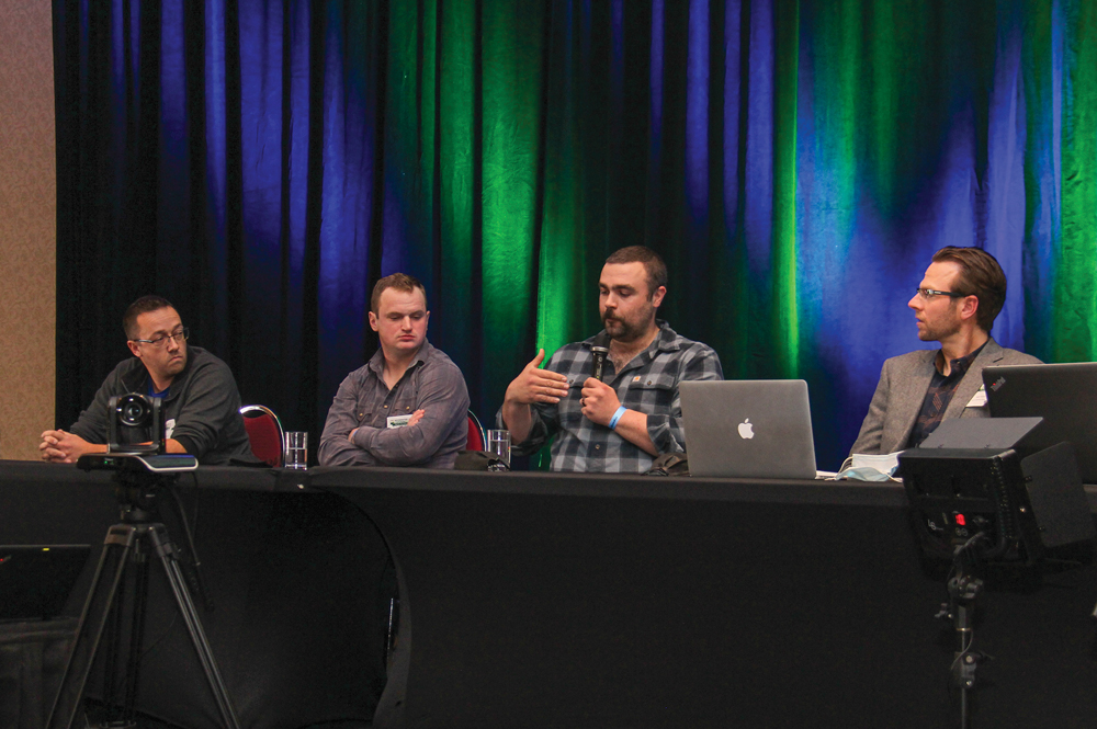 Regenerative dairy farmers Henry Nyhof (left to right), Sean Smith and Paul Kernaleguen with conference organizer Ryan Boyd.