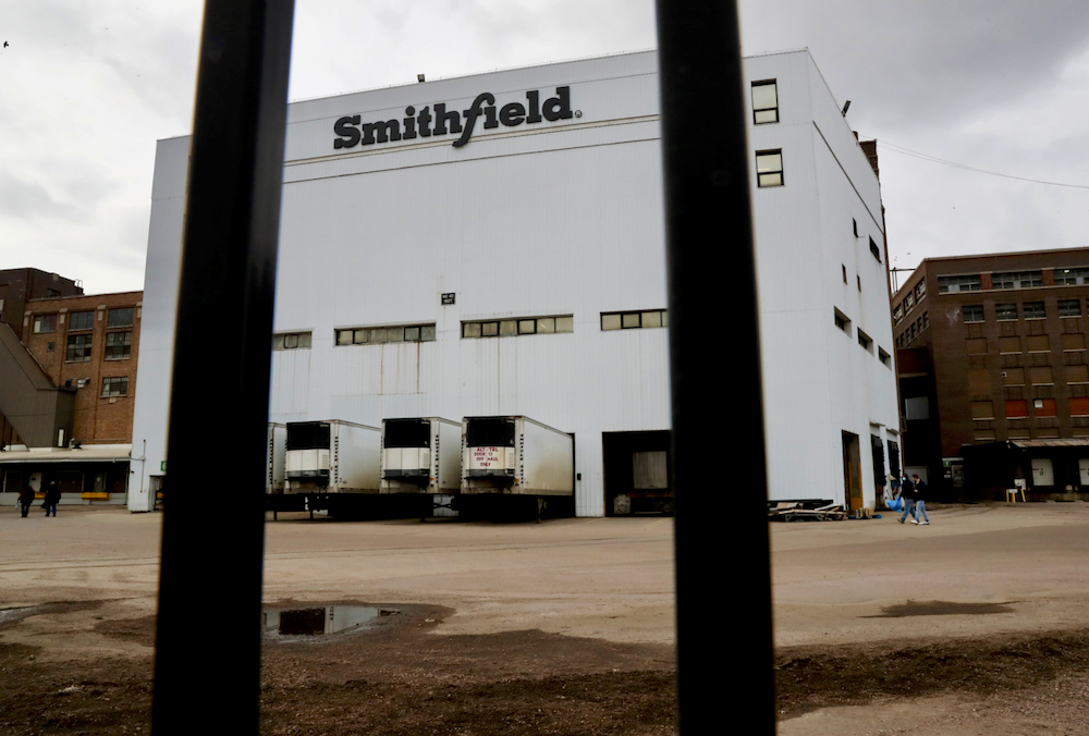 Workers exit the Smithfield Foods pork plant as the spread of the coronavirus disease (COVID-19) continues, in Sioux Falls, South Dakota, U.S., April 16, 2020.
