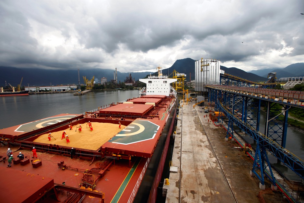 Employees working at a cargo ship at Tiplam terminal in Santos, Brazil in 2017.
