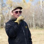 Zack Koscielny tours visitors through his cover crops and perennial pastures during a field tour in 2022.