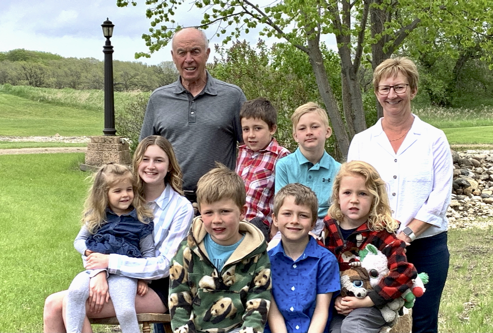 Gordon and Val Turner pose with their seven grandchildren.