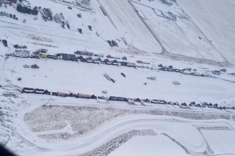 A supplied aerial photo of vehicles blocking through traffic on Feb. 1, 2022 at the Canada-U.S. border crossing between Coutts, Alta. and Sweet Grass, Montana. (Photo courtesy Alberta RCMP)
