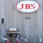 Employees walk around with face masks at the JBS USA meat packing plant at Greeley, Colorado on April 14, 2020. (File photo: Reuters/Shannon Stapleton)
