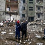 Rescuers work at a residential building damaged by recent shelling, as Russia's invasion of Ukraine continues, in Chernihiv, Ukraine March 3, 2022.