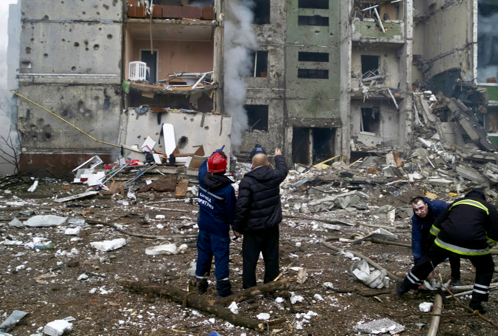 Rescuers work at a residential building damaged by recent shelling, as Russia's invasion of Ukraine continues, in Chernihiv, Ukraine March 3, 2022.