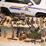 RCMP on Feb. 14, 2022 reported seizing the guns, ammunition and other items shown here during a search of three trailers "associated to" a group involved with the Coutts, Alta. border blockade. (An earlier version of this caption incorrectly quoted RCMP as saying the trailers were at the blockade.) (Photo courtesy Alberta RCMP)