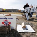 Teamsters union workers picket outside Canadian Pacific Railway’s Toronto Yard after the company halted operations and locked out employees over a labour dispute March 20, 2022.