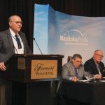 Iowa Pork Producers president Kevin Rasmussen (left) speaks alongside Manitoba Pork chair Rick Prejet (centre) and Minnesota Pork Producers president John Anderson (right).