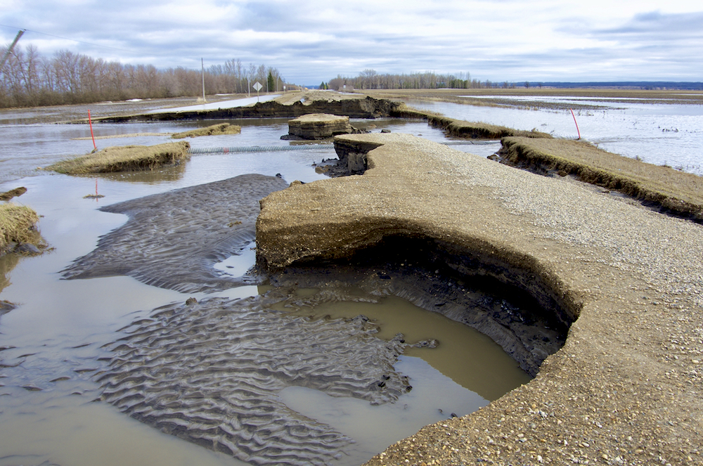 Flood waters leave extensive damage to PR 240, just below the Manitoba escarpment, May 2 after the third Colorado low to hit the region in as many weeks.