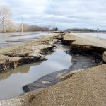 Flood waters leave extensive damage to PR 240, just below the Manitoba escarpment, May 2 after the third Colorado low to hit the region in as many weeks.