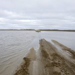 Municipal roads, such as this one in the R.M. of Thompson, went under water in the last weekend of April after the third Colorado low to hit the region in as many weeks.