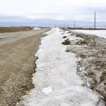 Ditches near Notre Dame de Lourdes remain packed with snow as flood waters hit communities below the Manitoba escarpment.