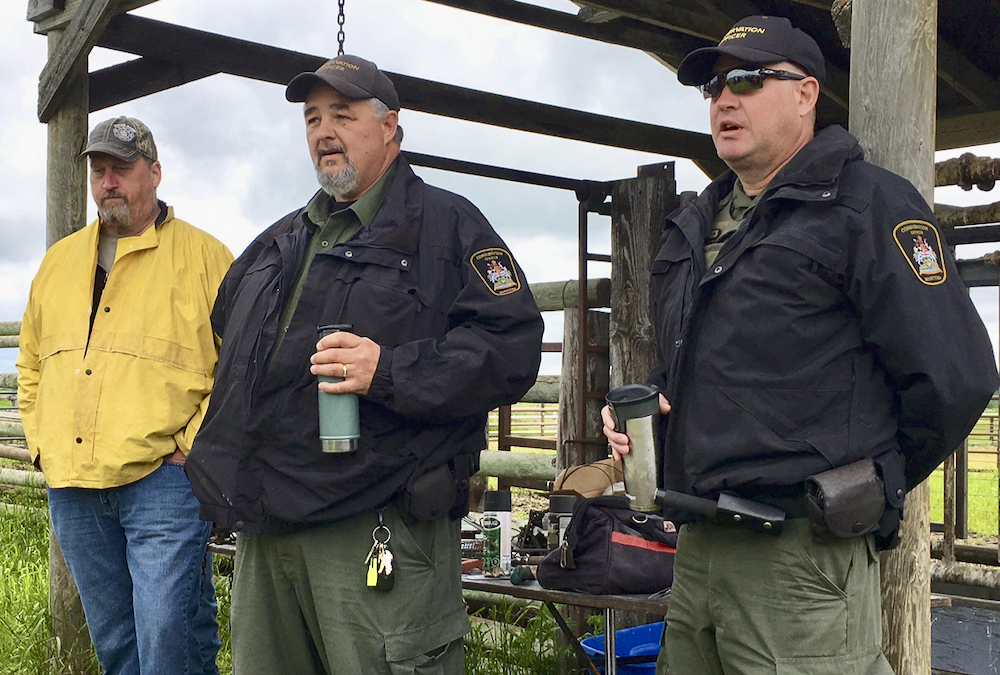 Local conservation officers speak during a field day hosted by the pilot project on June 21.