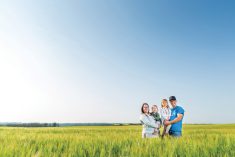 Crop prices need to stay high for farmers to recoup the record- breaking cost of this year’s crop, says Brent Konstapel (pictured with wife Megan and their
children Allison and Whitney).