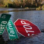 After Hurricane Ian made landfall in southwestern Florida, a street sign lies in flood waters at Punta Gorda, about 40 km north of Fort Myers, on Sept. 29, 2022. (Photo: Reuters/Shannon Stapleton)