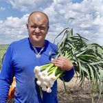 Volodymyr Fedorchuk, before the war, with some of the garlic he raised on now-occupied territory.