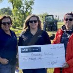 Teresa Fawns and Nicole McDonald of FCC, present a cheque to Sue Stirling, volunteer president of the Grandview Drop-In Centre.