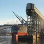 A freighter is loaded with grain from a terminal at Vancouver’s Burrard Inlet. (Maxvis/iStock/Getty Images)
