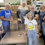 Manitoba Egg Farmers members and staff during an October visit to Manitoba Harvest to pack eggs for distribution to families.