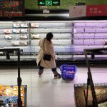 A customer looks at food items displayed on shelves at a supermarket, amid the COVID-19 outbreak in Shanghai, China on Nov. 30, 2022. (Photo: Reuters/Aly Song)
