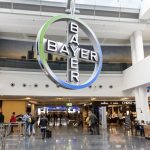 Bayer’s cross symbol hangs in a terminal at Frankfurt International Airport. (Typhoonski/iStock Editorial/Getty Images)