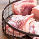 Raw pork in an iron basket