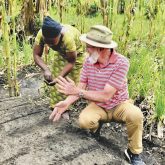Paul Hagerman plants seeds with a farmer in Shasha, Congo.
