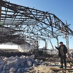 Grain farmer Andrii Povod stands in front of a destroyed barn at his farm, amid Russia’s invasion of Ukraine, in Bilozerka, Kherson region, Ukraine, Feb. 20.
