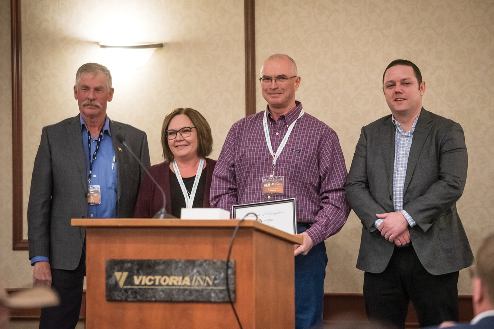 Pam and Glen Lowry (centre) are named this year’s Manitoba TESA winners during the Manitoba Beef Producers annual meeting in early February.