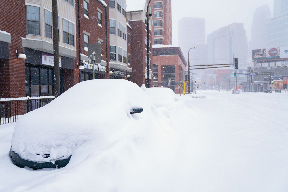 Cars are buried on Hennepin Avenue in Minneapolis on Feb. 23 by a winter storm that crossed the U.S. northern Plains and Midwest and brought needed precipitation to some winter wheat-growing areas.