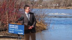 Stephen Carlyle, CEO of the Manitoba Habitat Heritage Corporation, speaks to media on the banks of the Red River in East St. Paul during the funding announcement.
