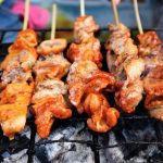 File photo of grilled pork intestine on skewers at a street food stall in the Philippines. (Junpinzon/iStock/Getty Images)