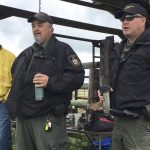 Conservation officers speak during a field day on livestock predation in 2022.