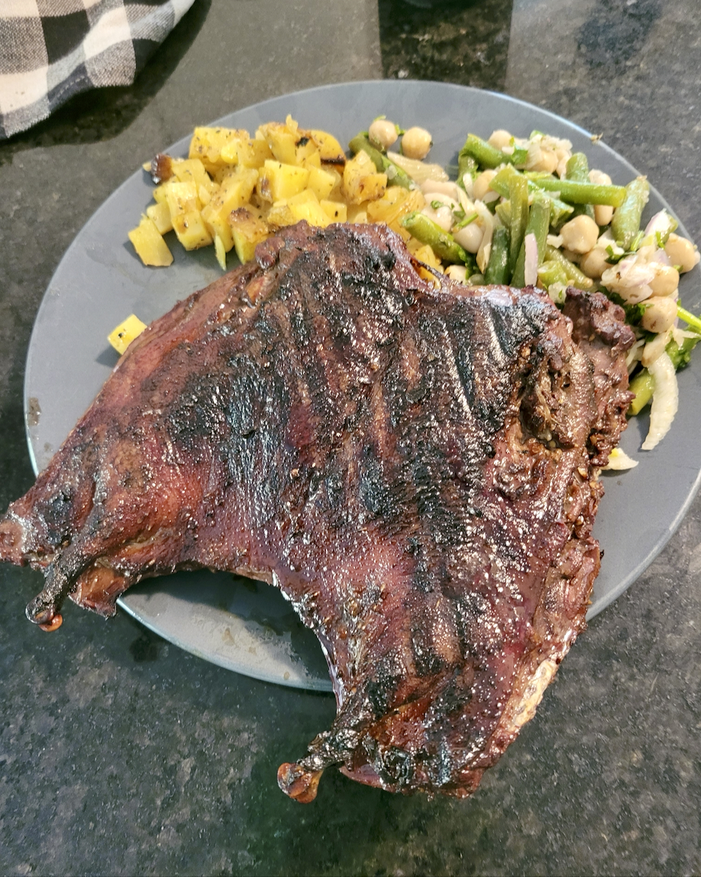 Barbecued duck from Duck Slough at the dinner table.