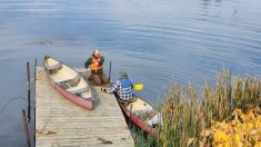 Teachers at the fall camp learn how to navigate in a canoe.