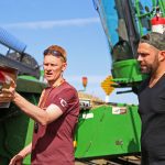 Kringe mounting a SmartPan system on a combine header