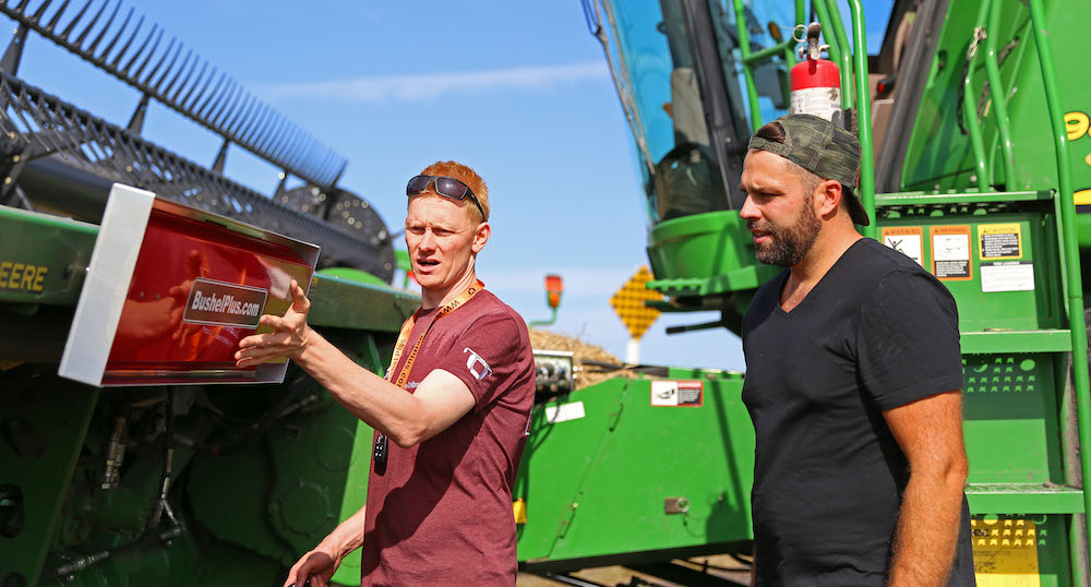 Kringe mounting a SmartPan system on a combine header