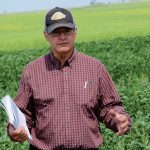 David Rourke takes field tour attendees through his on-farm trials in mid-2022.