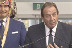 Ron Kostyshyn is sworn in on Oct. 18, 2023 as Manitoba’s minister for agriculture, with Premier Wab Kinew at left.