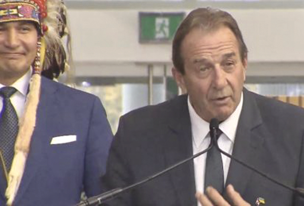 Ron Kostyshyn is sworn in on Oct. 18, 2023 as Manitoba’s minister for agriculture, with Premier Wab Kinew at left.