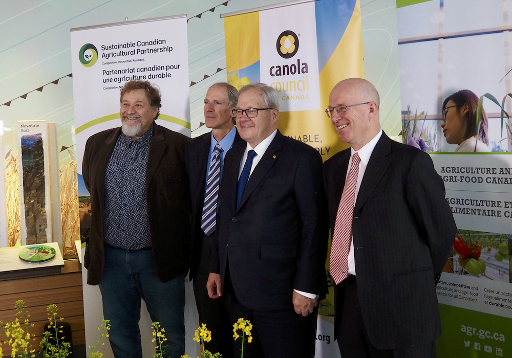 Left to right: Mario Tenuta (University of Manitoba), Curtis Rempel (Canola Council of Canada), Lawrence MacAulay, federal agriculture minister, University of Manitoba dean Martin Scanlon. The men spoke during a funding announcement at the Bruce D. Campbell Farm and Food Discovery Centre at Glenlea, Man.